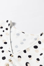 Green polka dot print blouse with button front and V-neck from Mommas Hive, stylish top for casual or office wear.