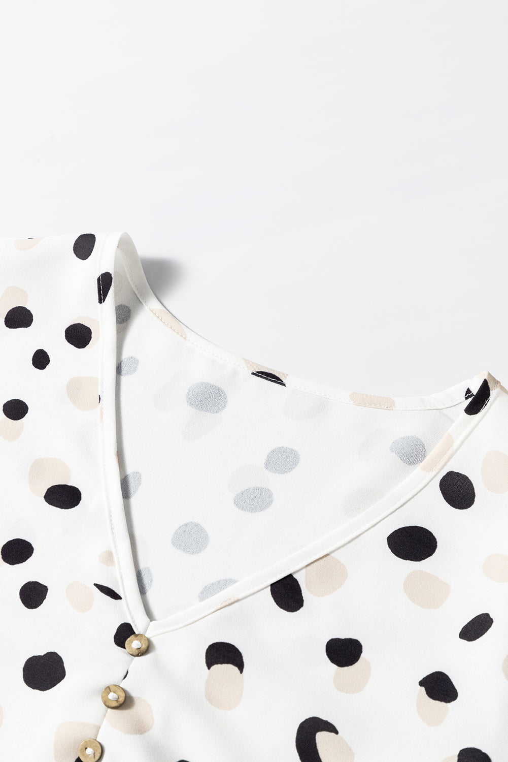 Green polka dot print blouse with button front and V-neck from Mommas Hive, stylish top for casual or office wear.