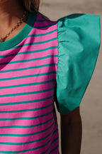 Pink stripe colorblock blouse with ruffled sleeves and crew neck from Mommas Hive, made of cotton and elastane fabric.
