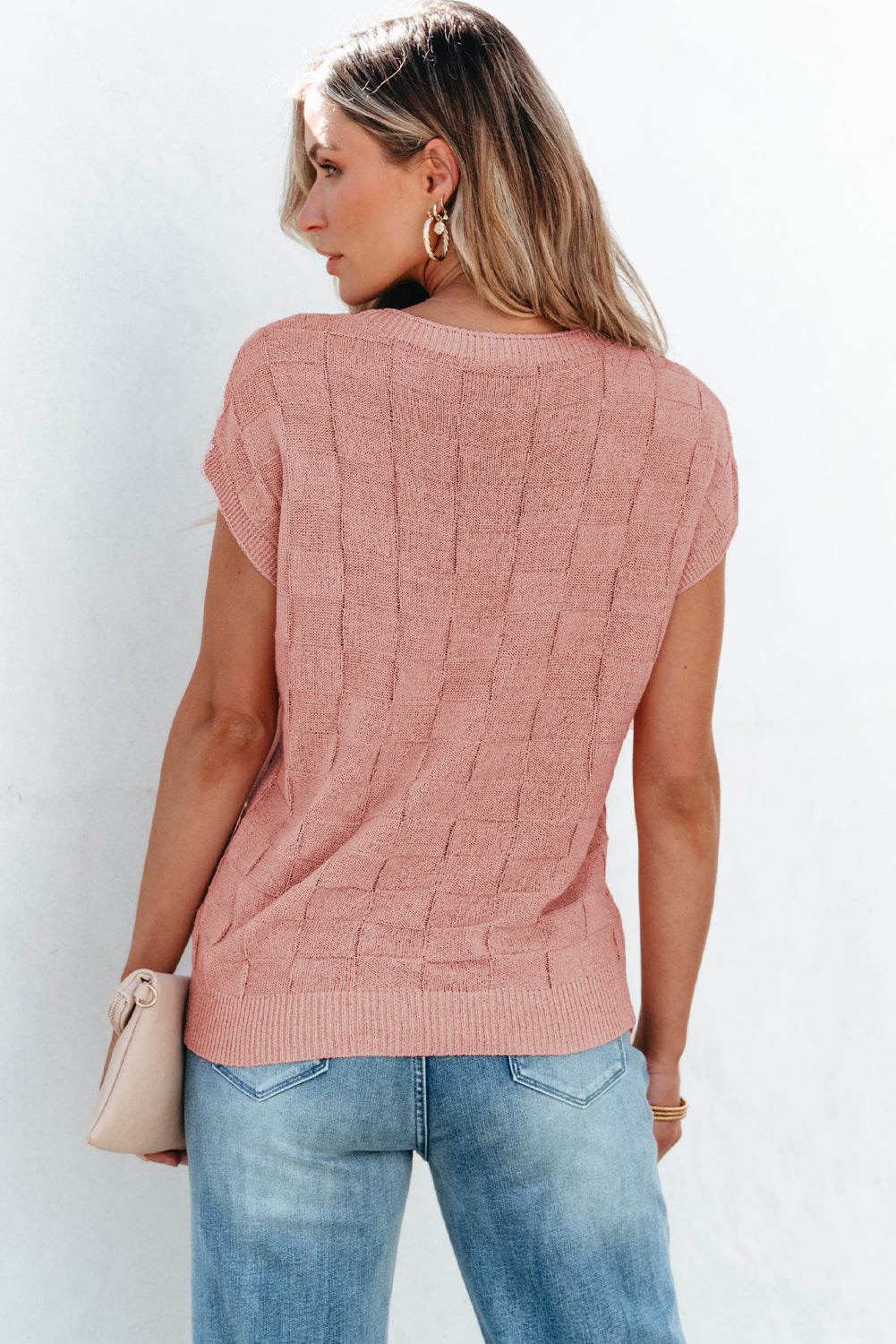 Bright pink Mommas Hive knit short sleeve sweater with lattice textured design, made from acrylic and polyamide fibers.