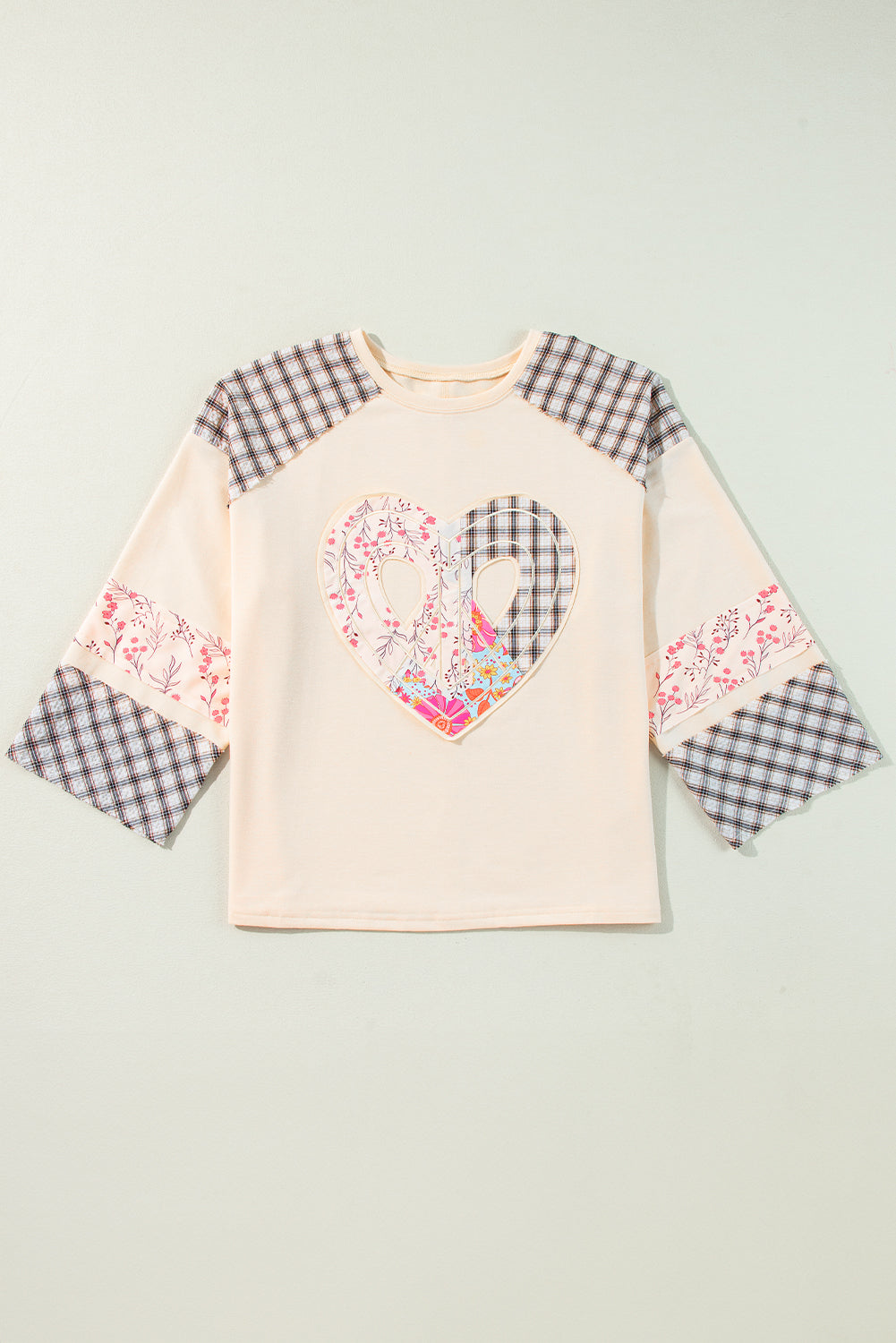 Beige plaid floral peace heart graphic long sleeve top from Mommas Hive, featuring wide fit and casual style.