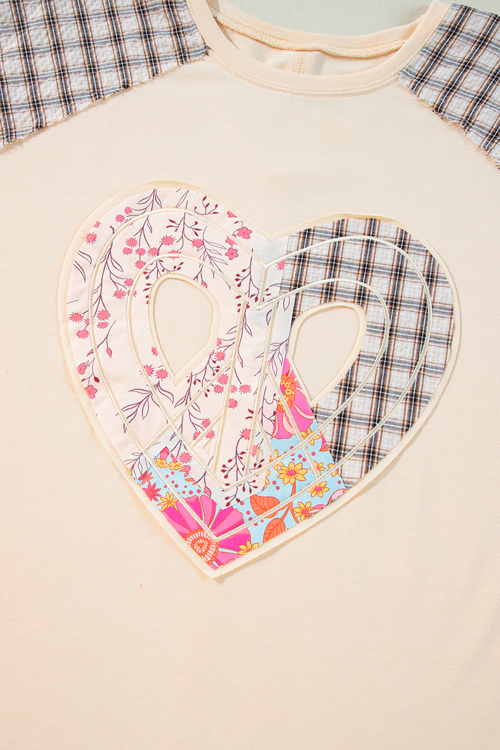 Beige plaid floral peace heart graphic long sleeve top by Mommas Hive, featuring wide fit and casual style.