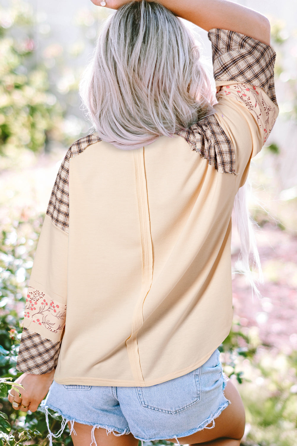 Beige plaid floral peace heart graphic long sleeve top by Mommas Hive, with wide fit, soft fabric blend of polyester, cotton, and elastane.