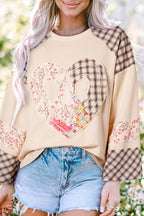 Beige plaid floral peace heart graphic long sleeve top from Mommas Hive, featuring a wide fit and casual style.