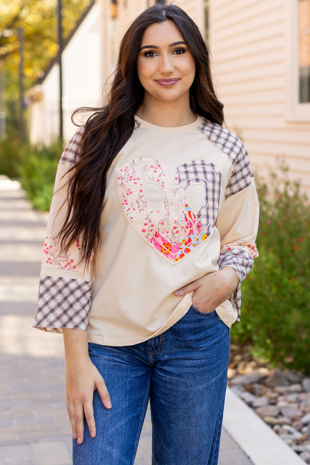 Beige plaid floral peace heart graphic long sleeve top by Mommas Hive, featuring a wide fit and casual style.
