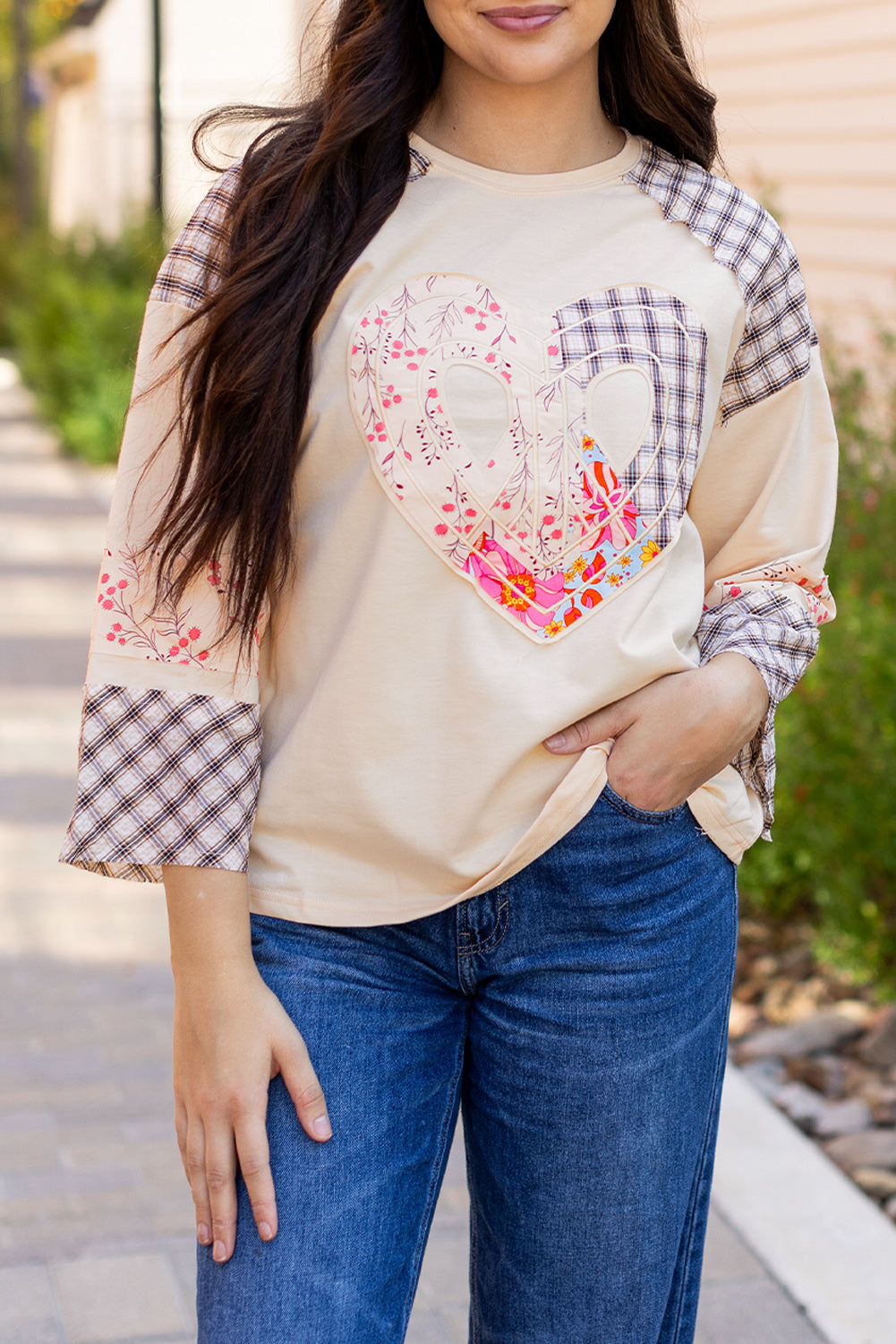 Beige plaid floral peace heart graphic long sleeve top by Mommas Hive, featuring wide sleeves and casual style.