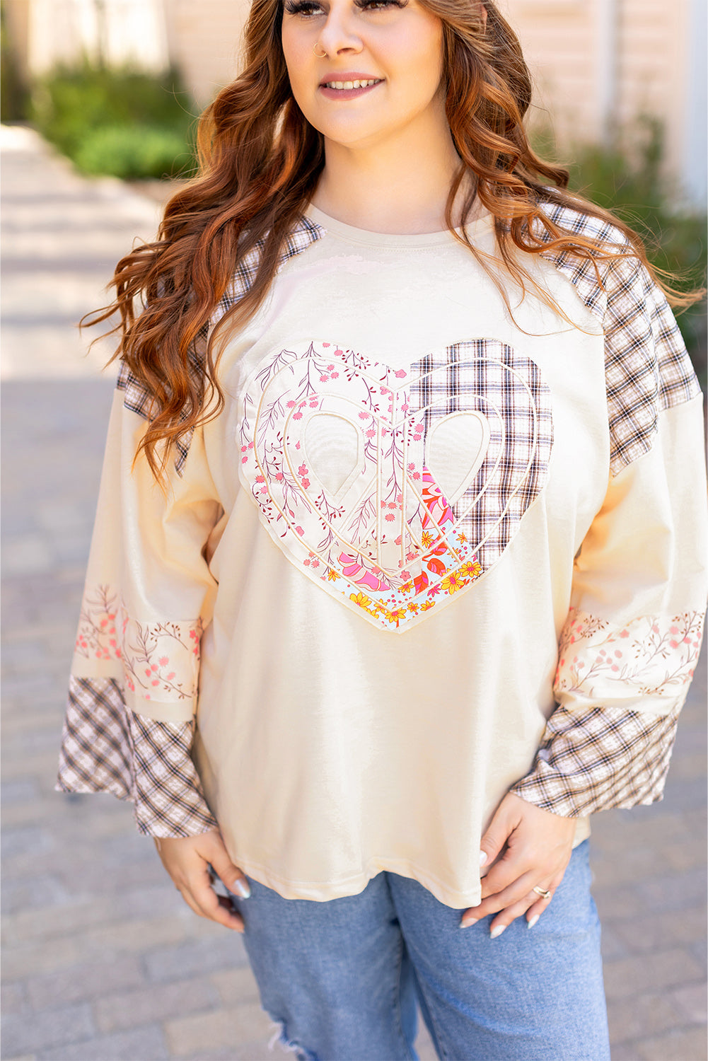 Beige plaid floral peace heart graphic long sleeve top by Mommas Hive, featuring wide fit and casual style.