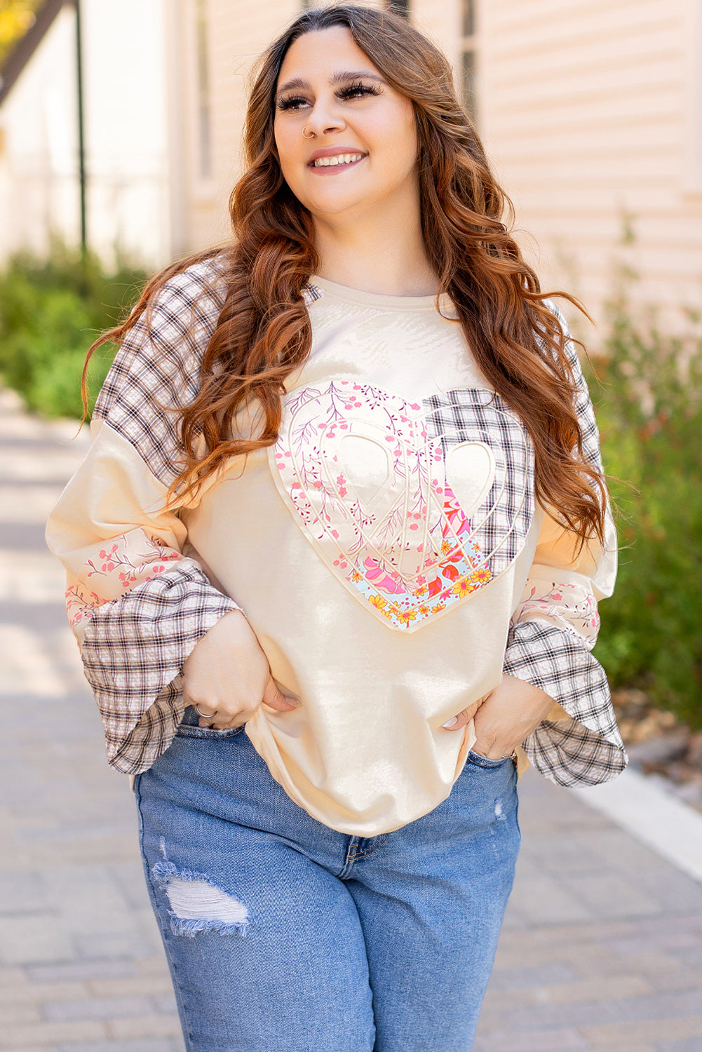 Beige plaid floral peace heart graphic long sleeve top by Mommas Hive, showing the wide fit and detailed pattern.