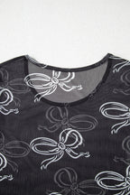 Black round neck long sleeve mesh top with bow print from Mommas Hive, featuring a fitted design and sheer fabric.
