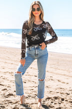 Black long sleeve mesh top with round neck and bow print by Mommas Hive, featuring a fitted design and sheer fabric.