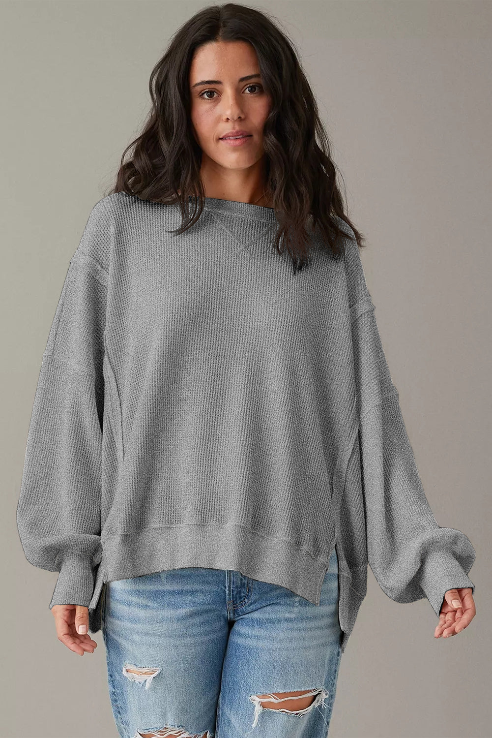 Gray waffle knit oversized long sleeve top with bishop sleeves and split design from Mommas Hive.