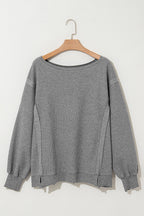 Gray waffle knit bishop sleeve split oversized top by Mommas Hive, long sleeve style with relaxed fit and stylish design.