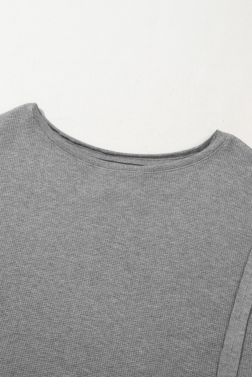 Gray waffle knit bishop sleeve split oversized top by Mommas Hive, long sleeve design with relaxed fit and stylish split detail.