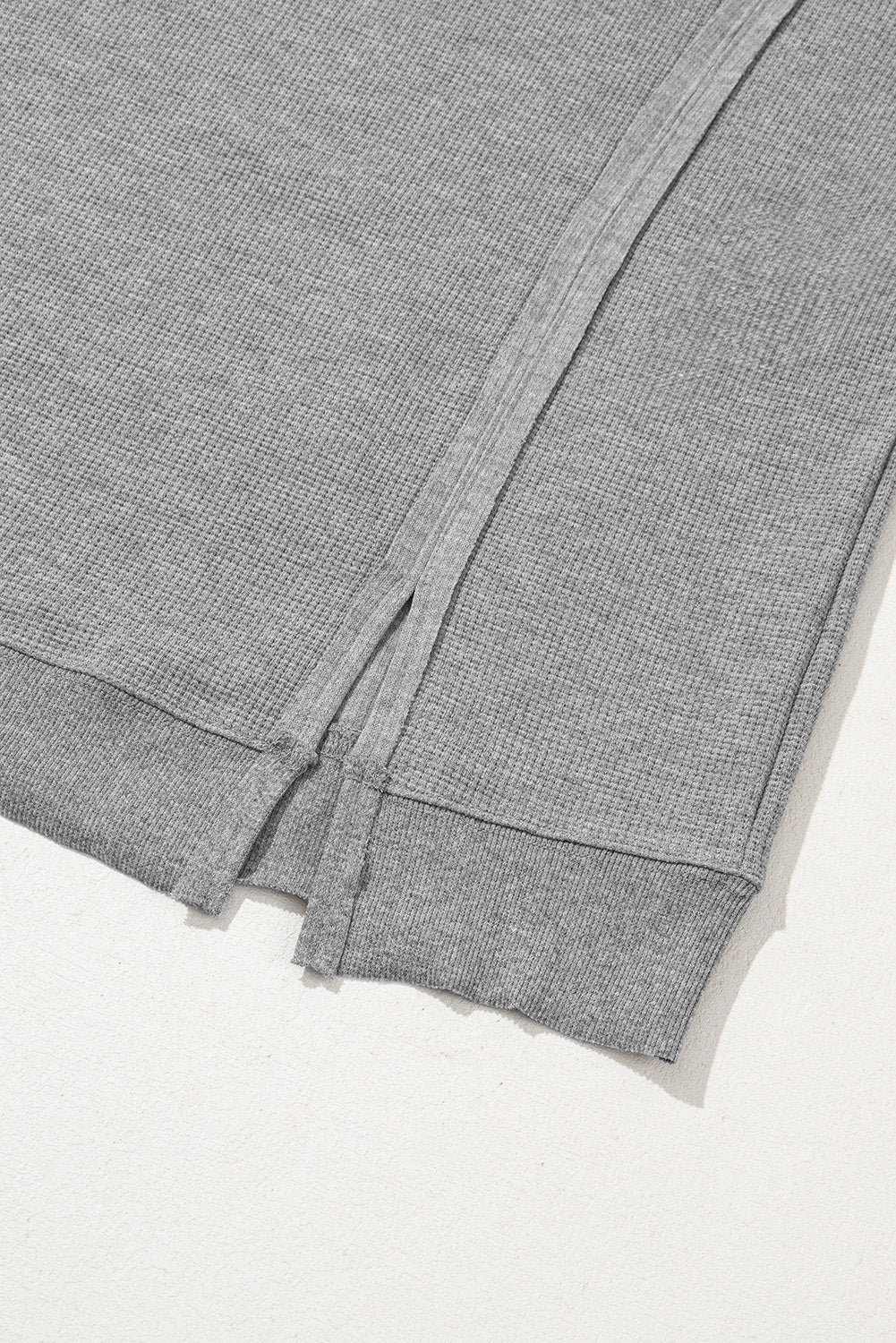 Gray waffle knit oversized top with bishop sleeves and split design by Mommas Hive, long sleeve casual fashion top.
