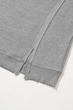 Gray waffle knit oversized top with bishop sleeves and split design by Mommas Hive, long sleeve casual fashion top.