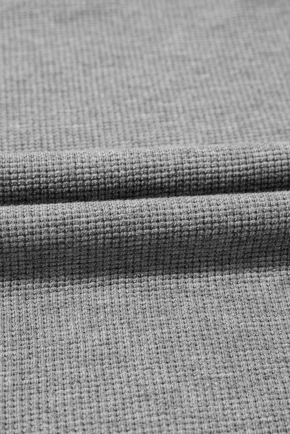 Gray waffle knit oversized long sleeve top with bishop sleeves and split design from Mommas Hive.