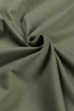 Jungle green Mommas Hive cowl neck shift tunic top with long sleeves, made of polyester, cotton, and elastane, displayed on a hanger