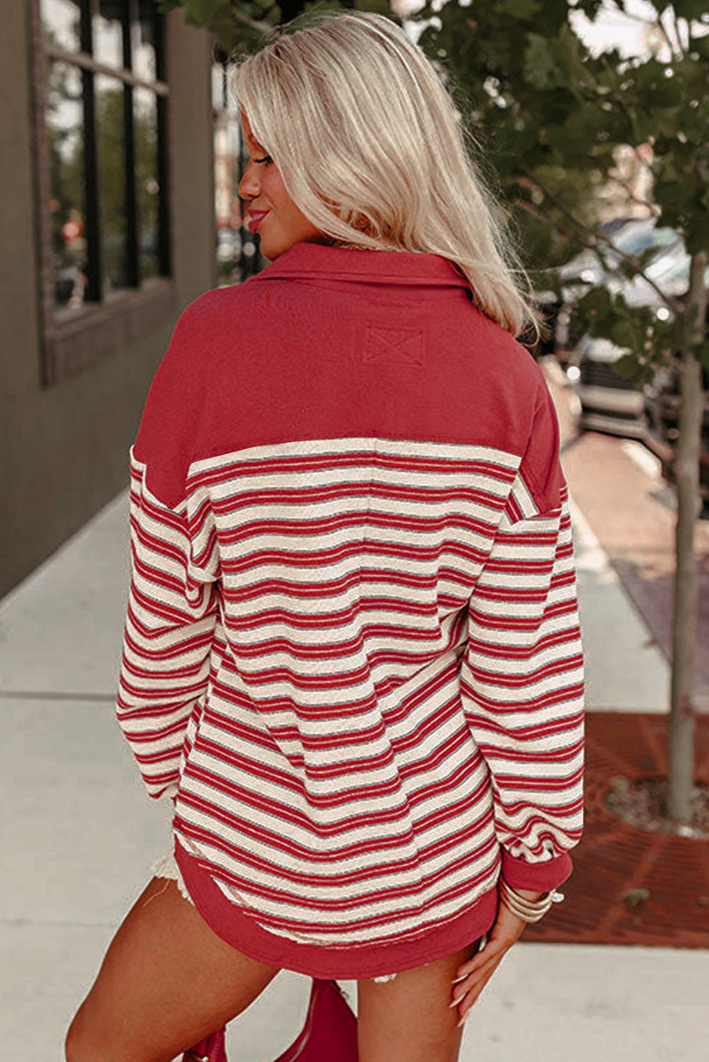 Red stripe long sleeve top by Mommas Hive with buttoned V-neck, collared design and drop shoulder style.