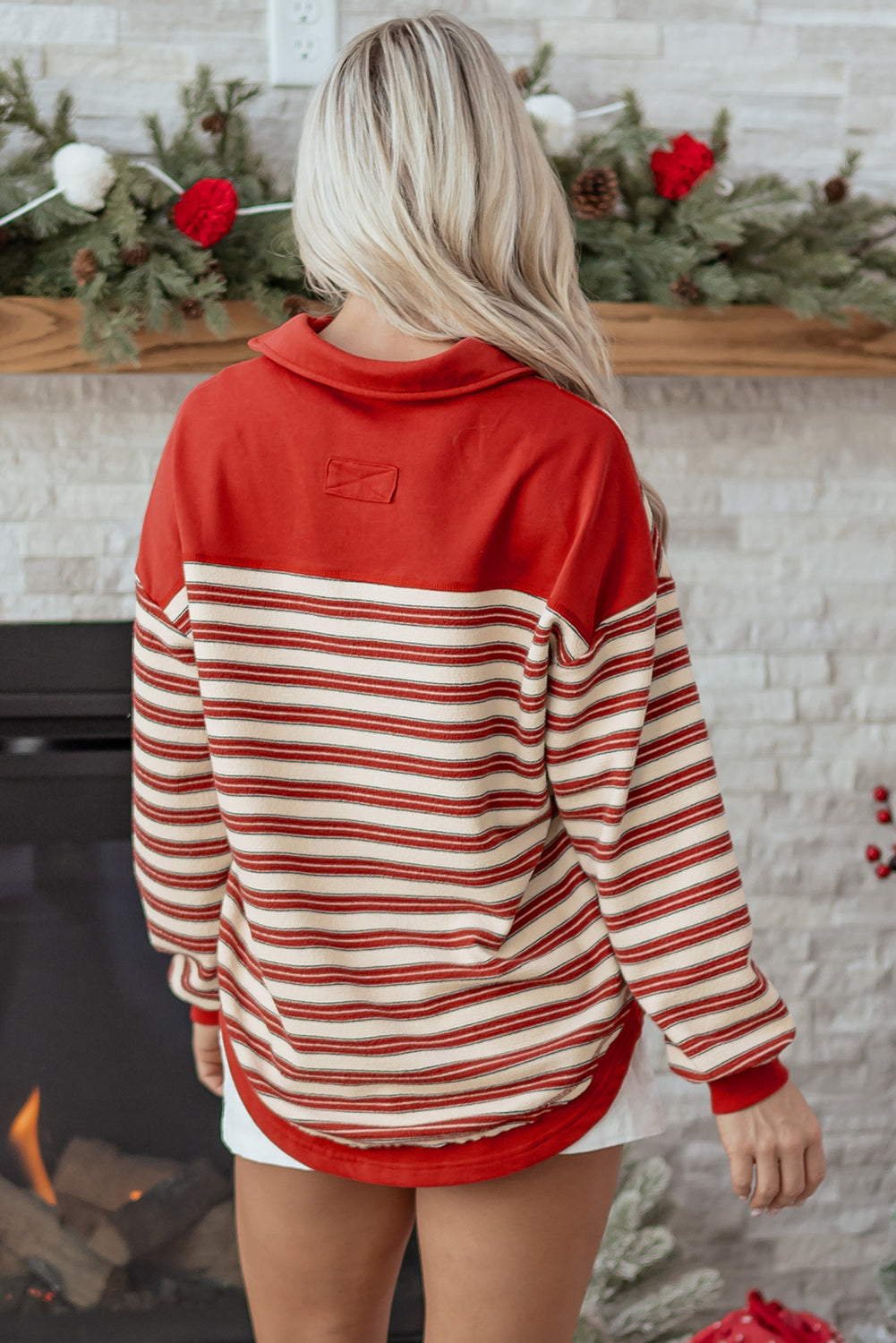 Red stripe long sleeve top by Mommas Hive featuring a buttoned V-neck, collared design, and drop shoulder style.