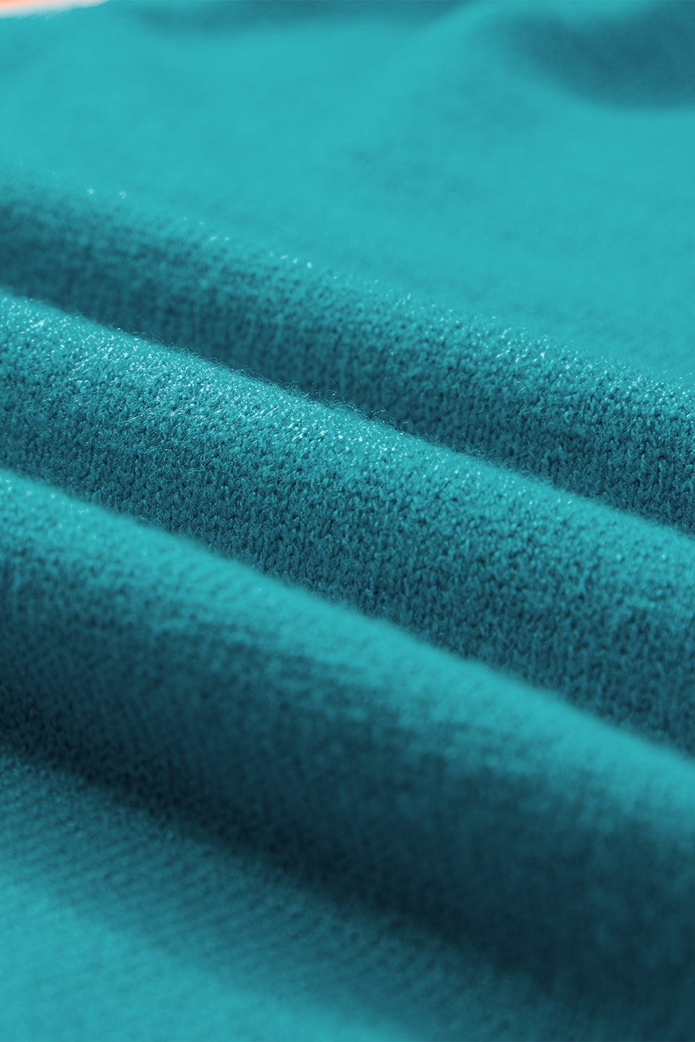 Mommas Hive turquoise knitted sweater T-shirt with contrast flutter sleeves, short sleeve top made of viscose, polyester, and polyamide.