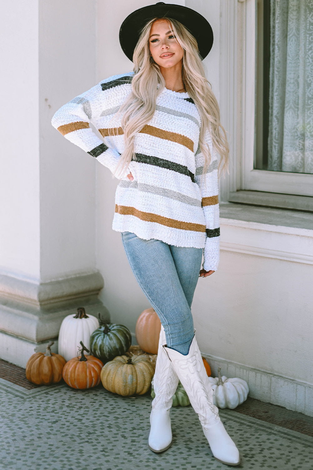 Striped popcorn knit sweater in vibrant colors, featuring a cozy top from Mommas Hive with a textured knit design.