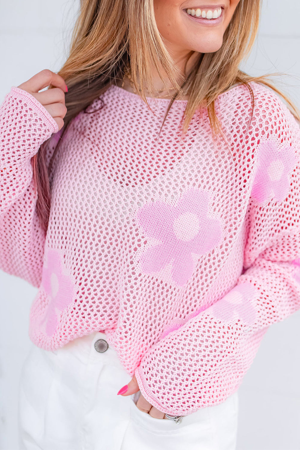 Light pink Mommas Hive knit sweater with large flower pattern, drop shoulder design, hollowed knit texture, made from acrylic and cotton.