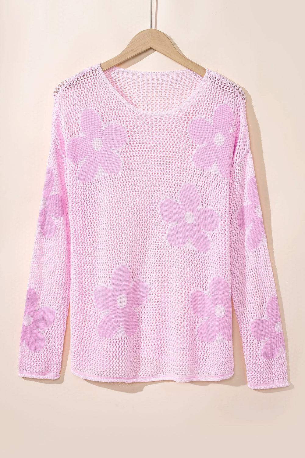 Light pink Mommas Hive knit sweater with large flower hollow design, drop shoulder style, made of acrylic and cotton.
