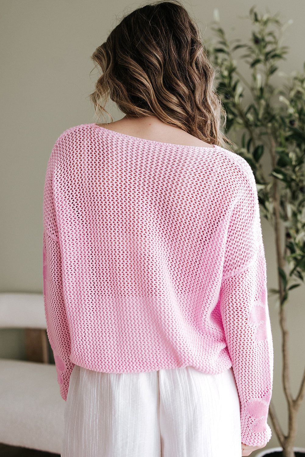 Light pink Mommas Hive sweater with large flower hollowed knit, drop shoulder design, made of acrylic and cotton, cozy and stylish.