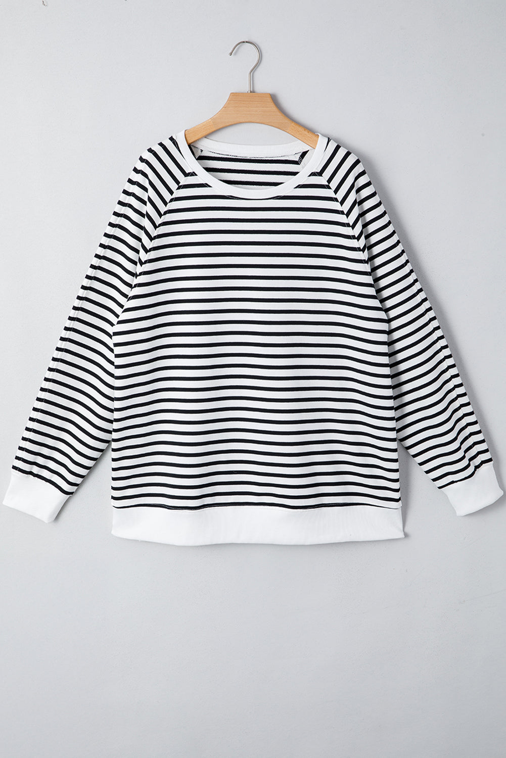Black stripe raglan sleeve loose sweatshirt from Mommas Hive with side slits, made of cotton and elastane, casual top for women.