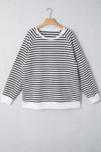 Black stripe raglan sleeve loose sweatshirt from Mommas Hive with side slits, made of cotton and elastane, casual top for women.