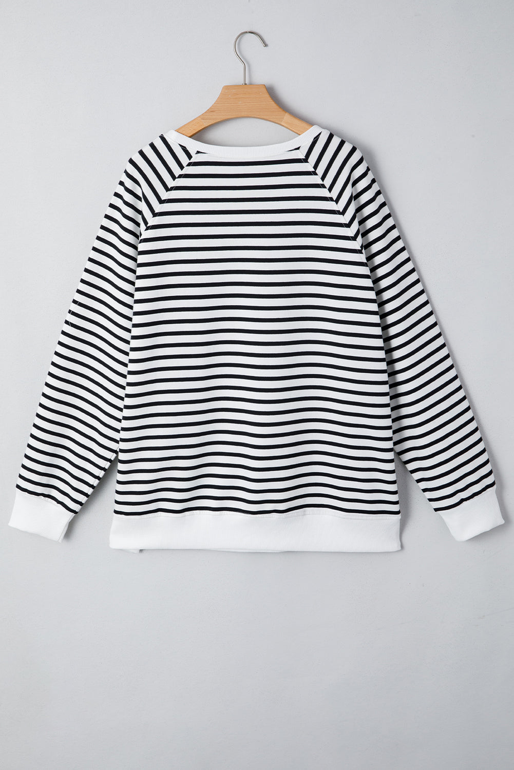 Black stripe raglan sleeve loose sweatshirt by Mommas Hive with side slits and cotton-elastane blend, casual and comfortable top.