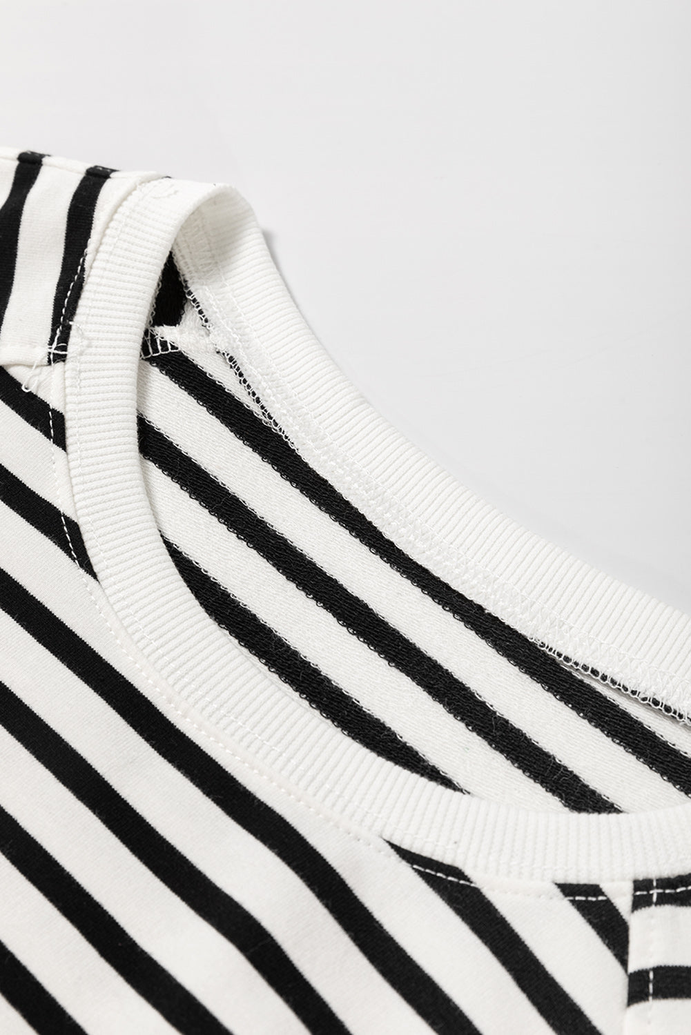 Black stripe raglan sleeve sweatshirt by Mommas Hive with side slits, loose fit, made of cotton and elastane, casual top for women.