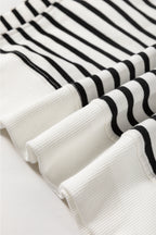 Black Stripe Raglan Sleeve Loose Sweatshirt by Mommas Hive featuring side slits and relaxed fit, made from cotton and elastane blend.