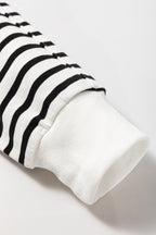 Black stripe raglan sleeve loose sweatshirt from Mommas Hive with side slits and relaxed fit, made of cotton and elastane.