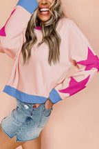 Light pink oversized sweatshirt with star patchwork and exposed seams, made by Mommas Hive, casual and cozy tops for women.