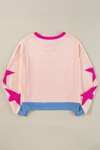 Light pink oversized sweatshirt with star patchwork and exposed seams from Mommas Hive, made of polyester and cotton.