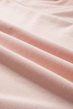 Light pink oversized sweatshirt by Mommas Hive with star patchwork, exposed seams, and a cozy, casual fit.
