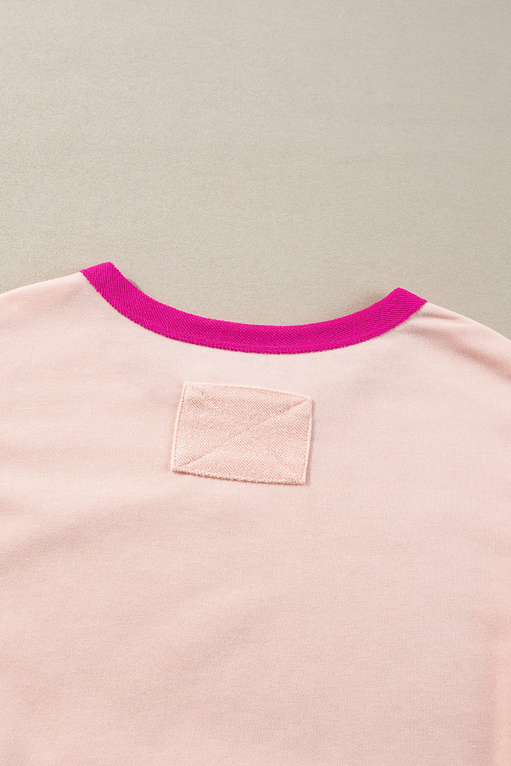 Light pink oversized sweatshirt with star patchwork and exposed seams from Mommas Hive, made of polyester and cotton blend.