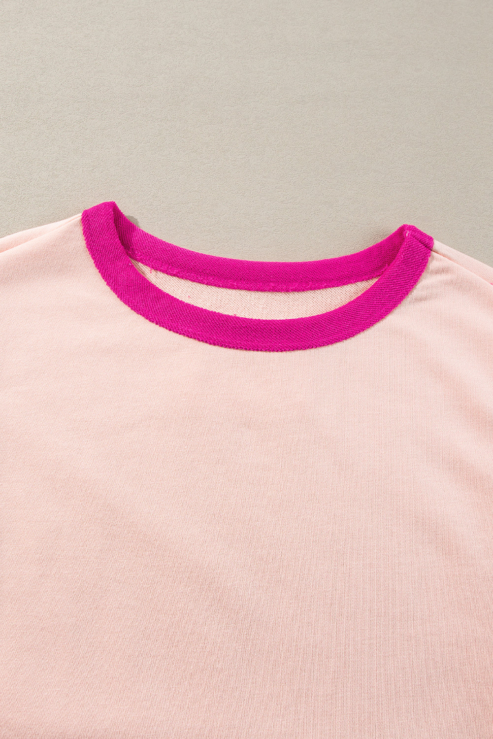 Light pink oversized sweatshirt with star patchwork and exposed seams from Mommas Hive, casual and comfortable tops for women.
