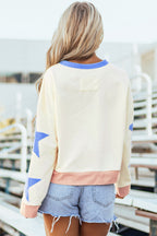 Light pink oversized sweatshirt with star patchwork and exposed seams by Mommas Hive, made of polyester and cotton blend.
