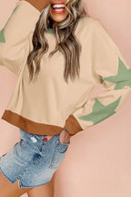 Light pink oversized sweatshirt by Mommas Hive with star patchwork and exposed seams, made of polyester and cotton blend.
