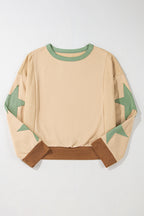 Light pink oversized sweatshirt with star patchwork and exposed seams from Mommas Hive, made of polyester and cotton blend.