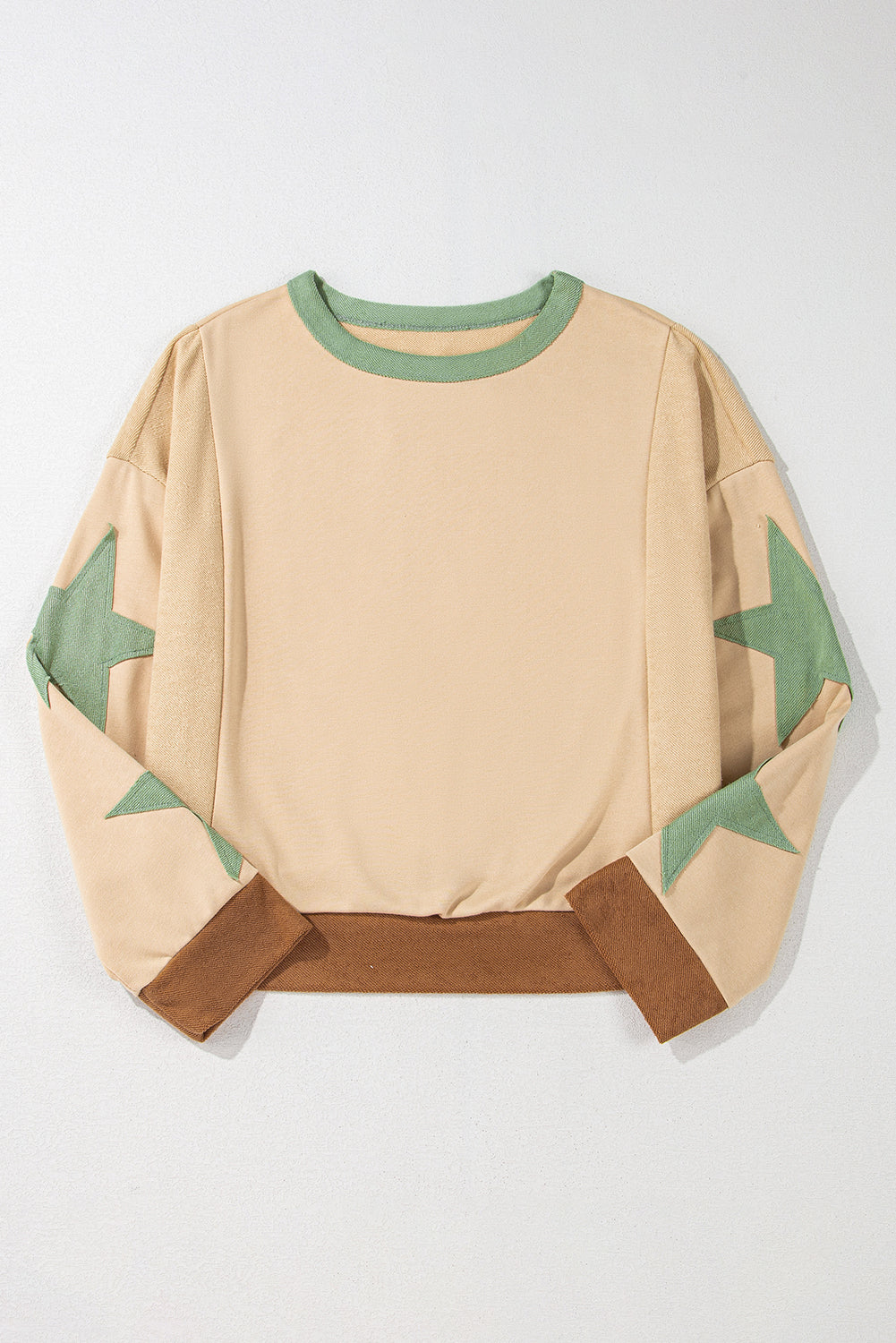 Light pink oversized sweatshirt with star patchwork and exposed seams from Mommas Hive, made of polyester and cotton blend.