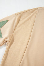Light pink oversized sweatshirt by Mommas Hive with star patchwork and exposed seams, made of polyester and cotton blend.