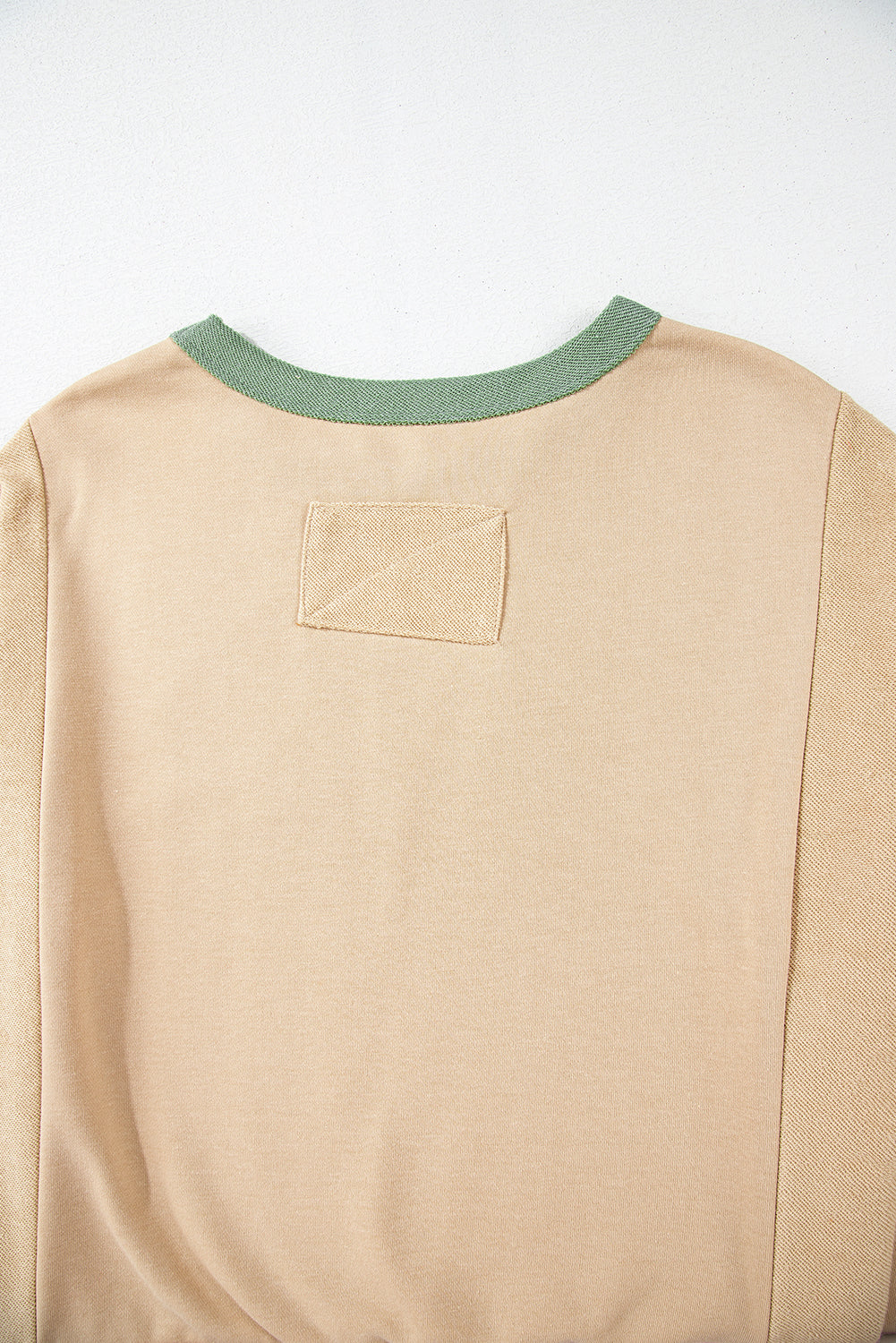 Light pink oversized sweatshirt with star patchwork and exposed seams from Mommas Hive, made of polyester and cotton blend.