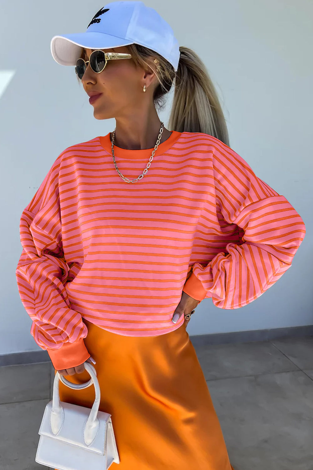 Orange stripe drop shoulder crew neck sweatshirt by Mommas Hive, loose fit, made of polyester, cotton, and elastane, casual top.
