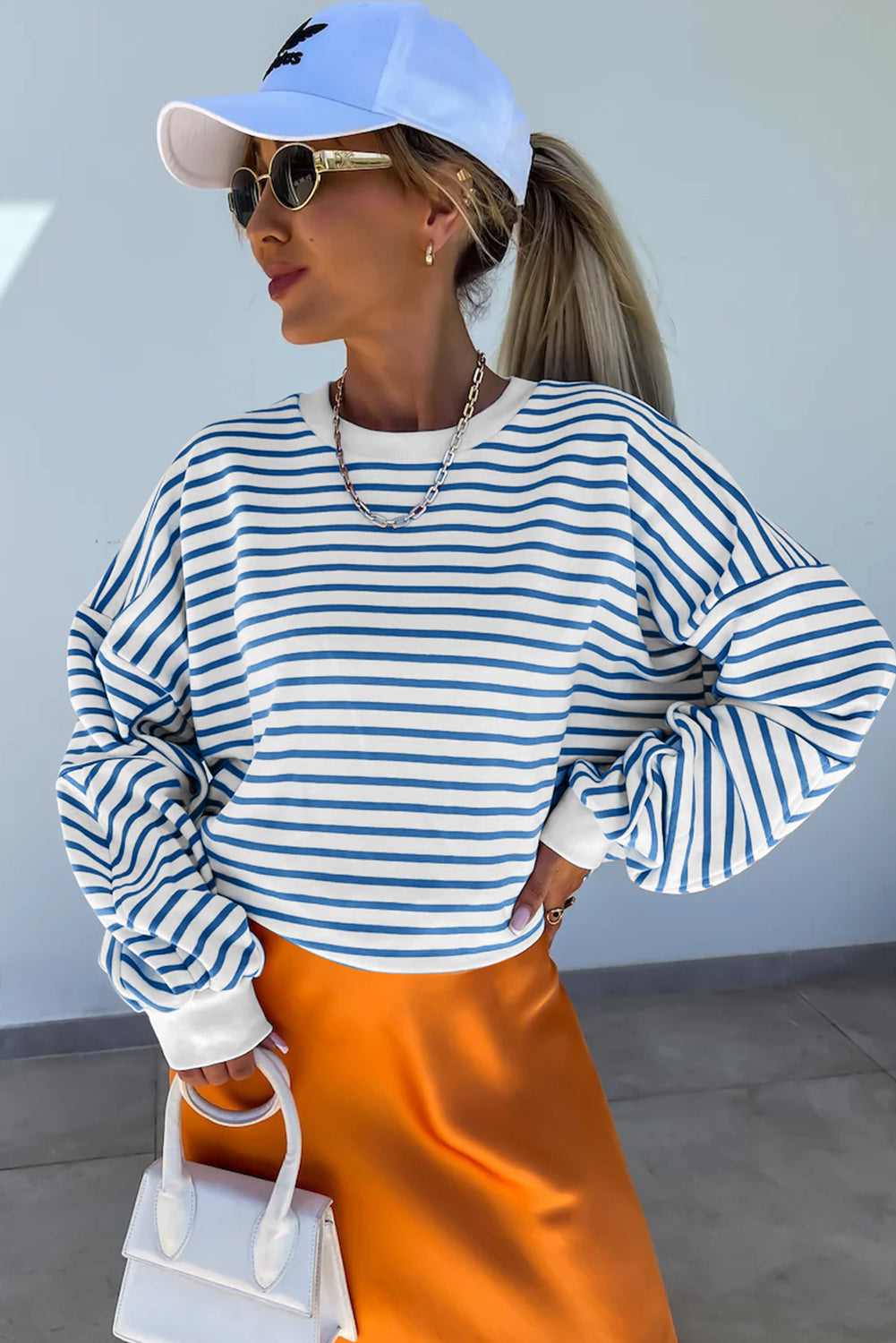 Orange stripe drop shoulder crew neck loose sweatshirt from Mommas Hive, featuring a relaxed fit and comfortable fabric blend.