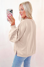 Mommas Hive oversized parchment sweatshirt with embroidered bow and lantern sleeves, made of polyester and cotton blend.