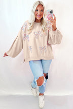 Mommas Hive oversized sweatshirt with parchment color, embroidered bow details, lantern sleeves, made of polyester and cotton blend.