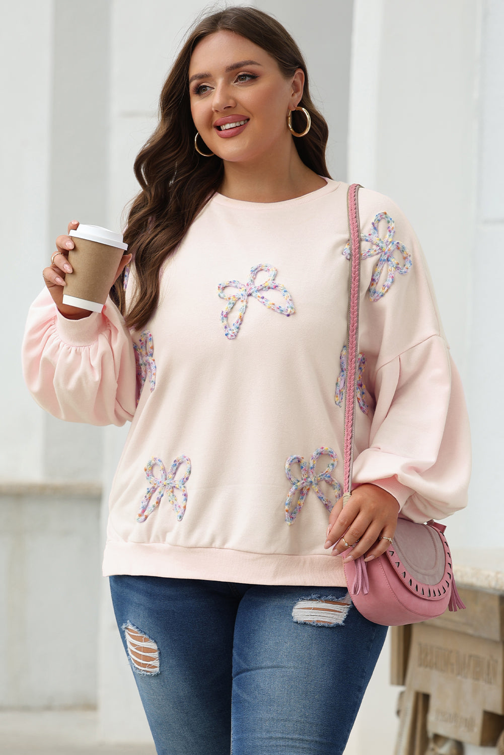 Parchment-colored embroidered bow lantern sleeve oversized sweatshirt by Mommas Hive, made of polyester and cotton, casual fit.